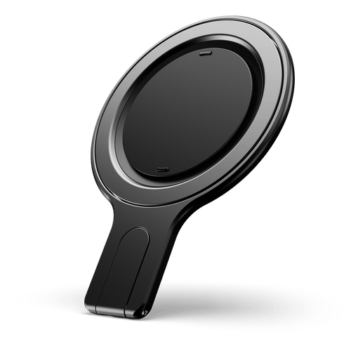Black circular phone grip stand with a flat base and a raised edge.