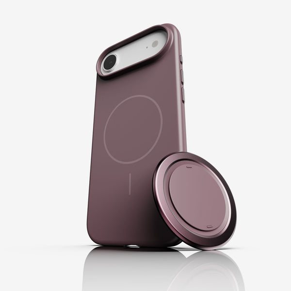 Purple iPhone case with a magnetic grip attachment, featuring a circular design on the back.