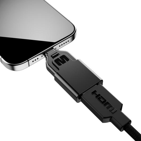 Black HDMI connector plugged into a smartphone's charging port.