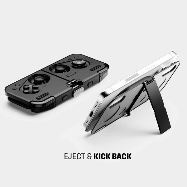 Black gaming controller with detachable stand, featuring buttons and joystick, positioned next to a smartphone.