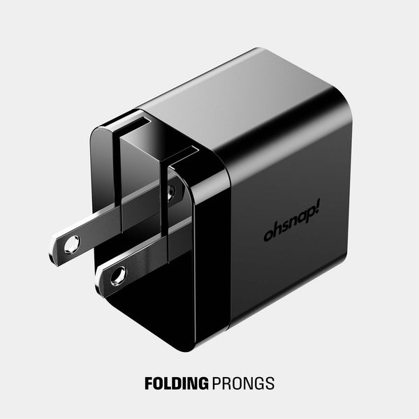 Black wall adapter with folding prongs and the brand name 
