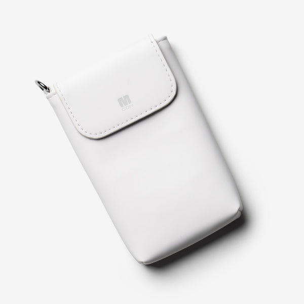 White travel sleeve with a flap closure and a logo on the front.