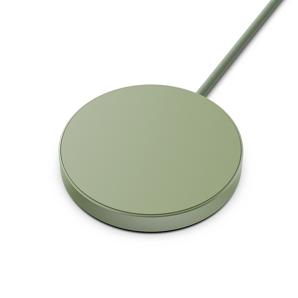 Round green wireless charging pad with a connected cable.