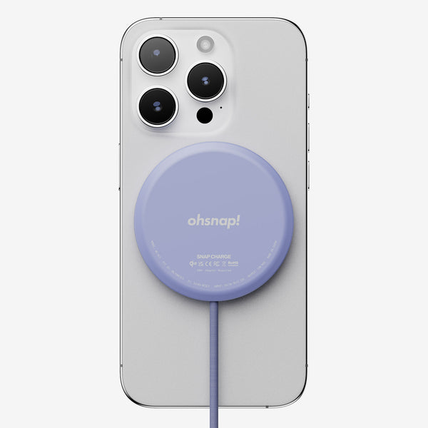 Purple wireless charger attached to a smartphone, featuring a cable extending from the charger.