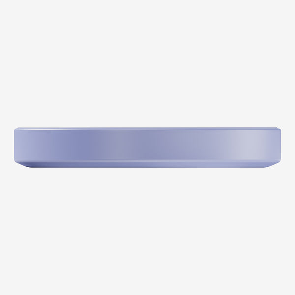 Flat, round wireless charger in a light purple color with a smooth surface.