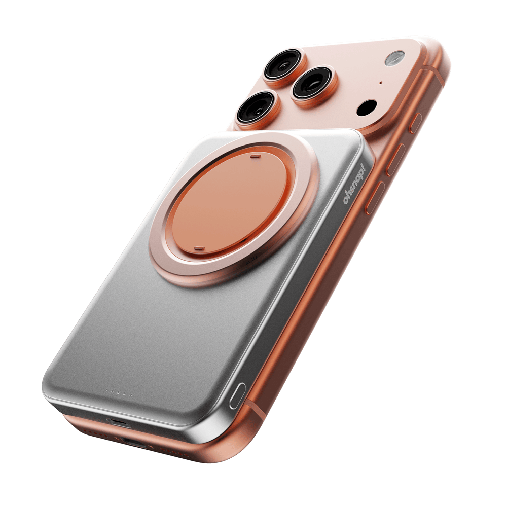 Accessory with a silver and copper design, featuring a circular attachment for a smartphone.