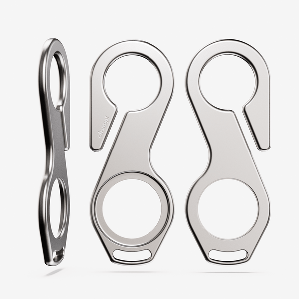 Two metal key loops with a sleek design, featuring circular openings and a hook for attachment.