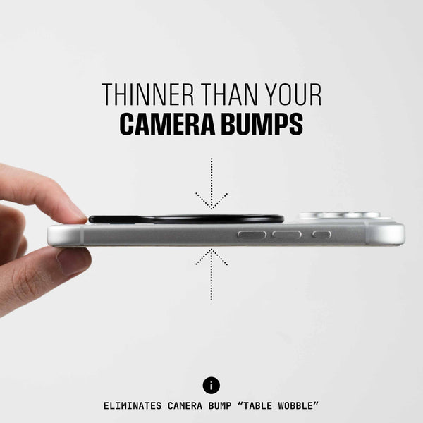 A hand holds a smartphone with a thin accessory attached, showing its slim profile compared to the camera bump.