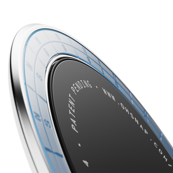 Circular adhesive disc with a black center and a blue grid pattern around the edge, featuring text and a patent notice.