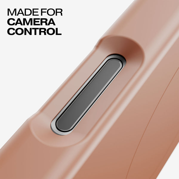 Close-up of a pink snap case featuring a button for camera control.