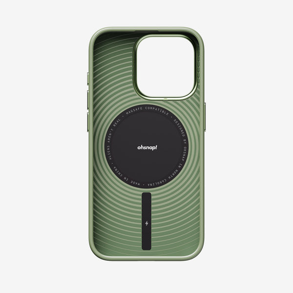 Green phone case with a circular MagSafe charging area and wavy line design, compatible with 15 Series devices.