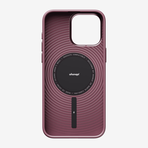 Purple phone case with circular design and MagSafe compatibility, featuring a central logo and a vertical button.