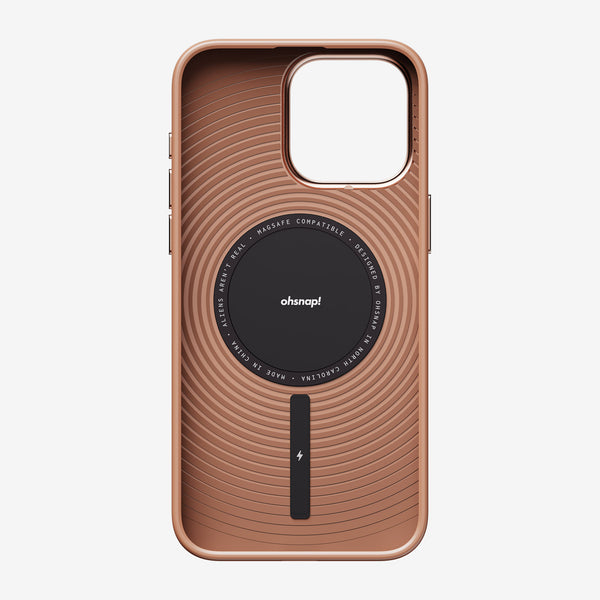 Rose gold phone case with a textured design and a central magnetic charging area, compatible with MagSafe.