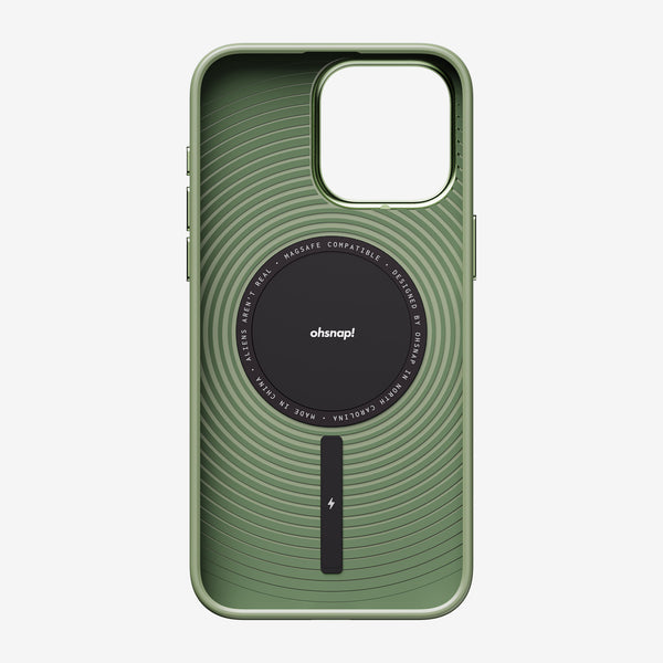 Green phone case with a textured design and a circular MagSafe-compatible attachment in the center.