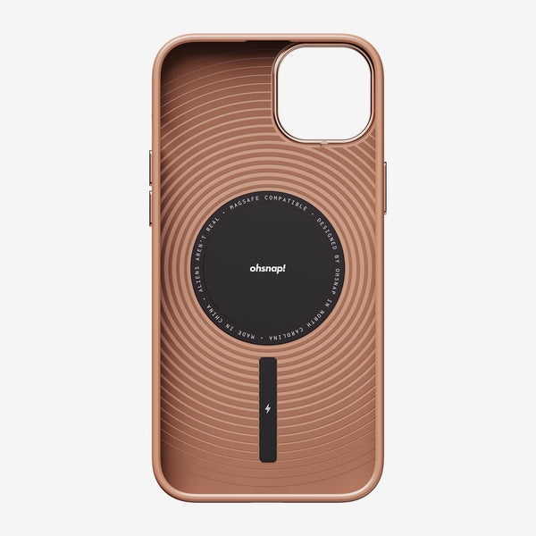 Rose gold phone case with circular design and MagSafe compatibility, featuring a central black area with branding.