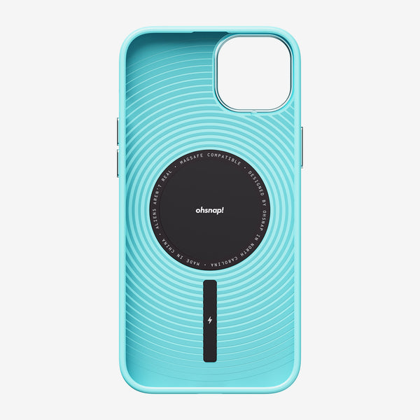 Light blue phone case with circular design and MagSafe compatibility, featuring a central black logo.
