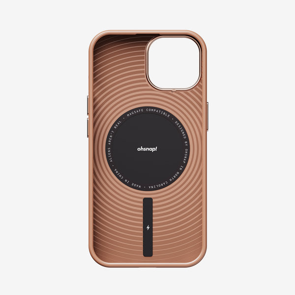 Rose gold phone case with circular design and MagSafe compatibility, featuring a central logo and charging indicator.