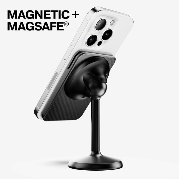 Magnetic wallet attached to a smartphone, mounted on a black stand with a smooth base.
