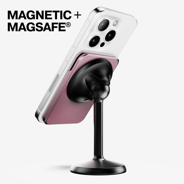 Magnetic wallet attached to a smartphone on a black stand, showcasing a pink color.