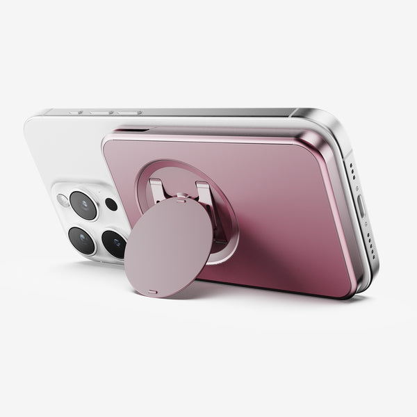 Wallet attachment in pink color mounted on the back of a smartphone, featuring a circular grip.