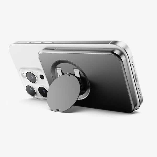 Wallet attachment on the back of a smartphone, featuring a circular grip for secure handling.