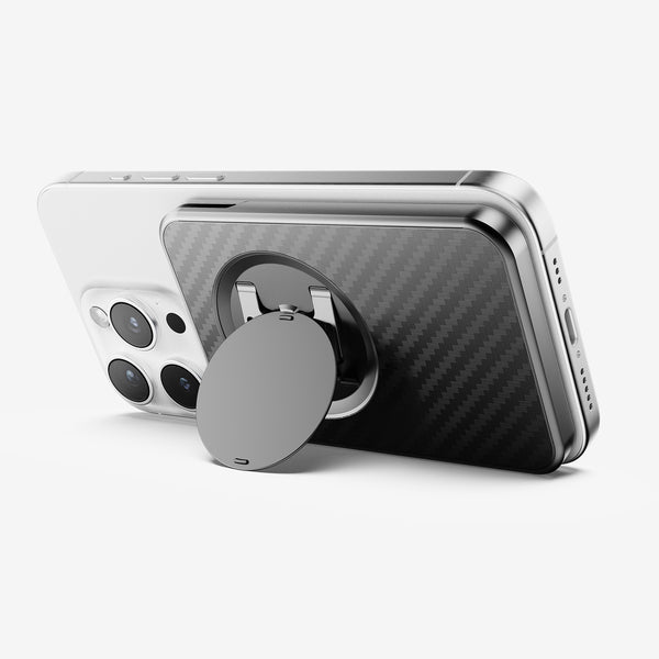 Wallet attachment on the back of a smartphone, featuring a circular grip and a carbon fiber design.