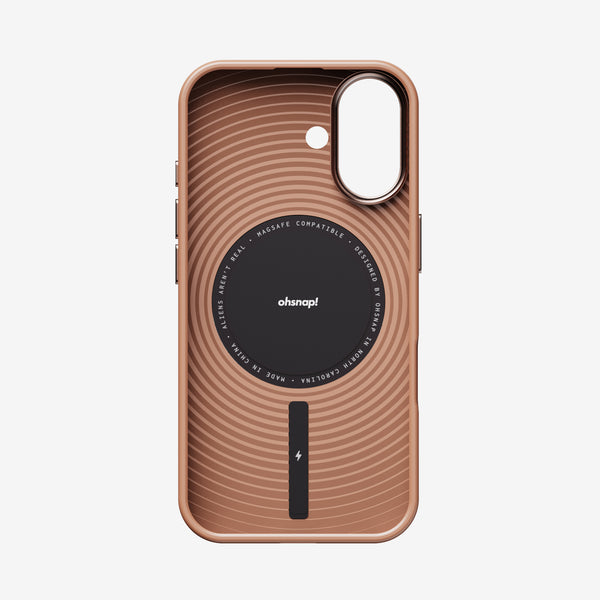 Rose gold phone case with concentric circle design and a central magnetic charging area.