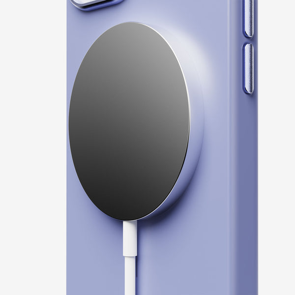 Purple phone case with a circular magnetic charging pad attached.