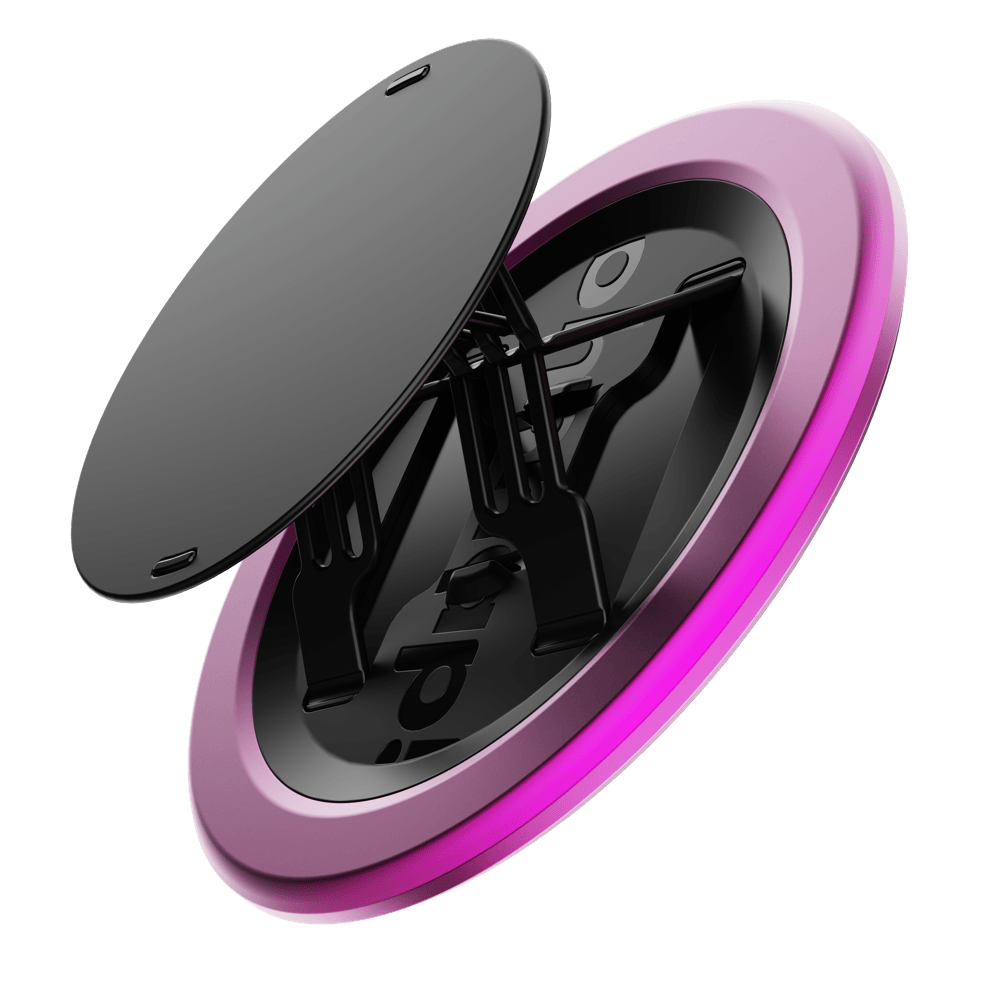 Circular phone grip with a black top and a pink outer ring, featuring a folding mechanism.