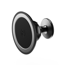 Black circular car mount with a metallic edge and a central logo, designed for secure device attachment.