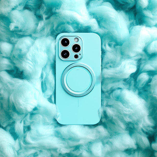 A light blue phone case with a circular magnetic attachment, set against a fluffy turquoise background.