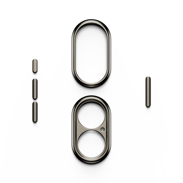 Trim kit components including two oval frames and several small cylindrical pieces in a metallic finish.