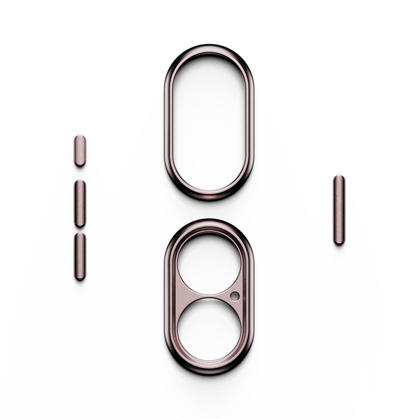 Trim kit components in a rose gold finish, including two oval frames and several small trim pieces.