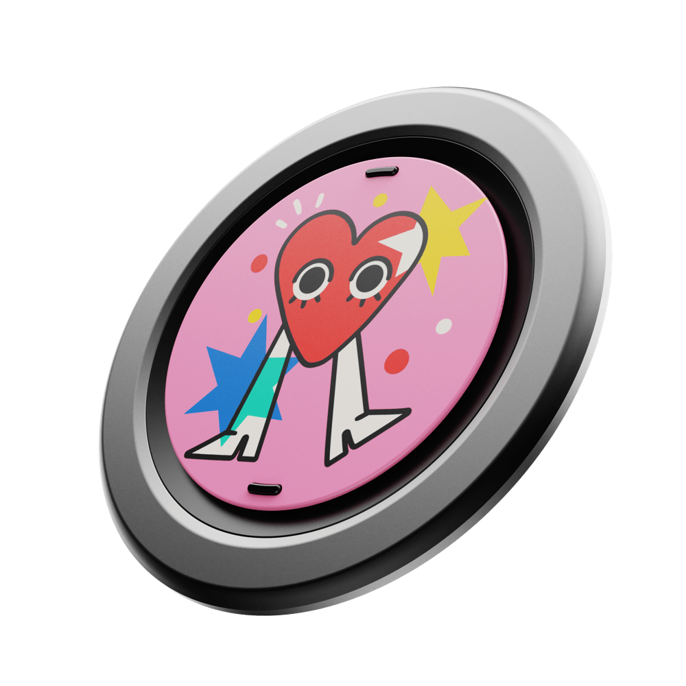 Round phone grip with a colorful heart design on a pink background, framed in a silver ring.