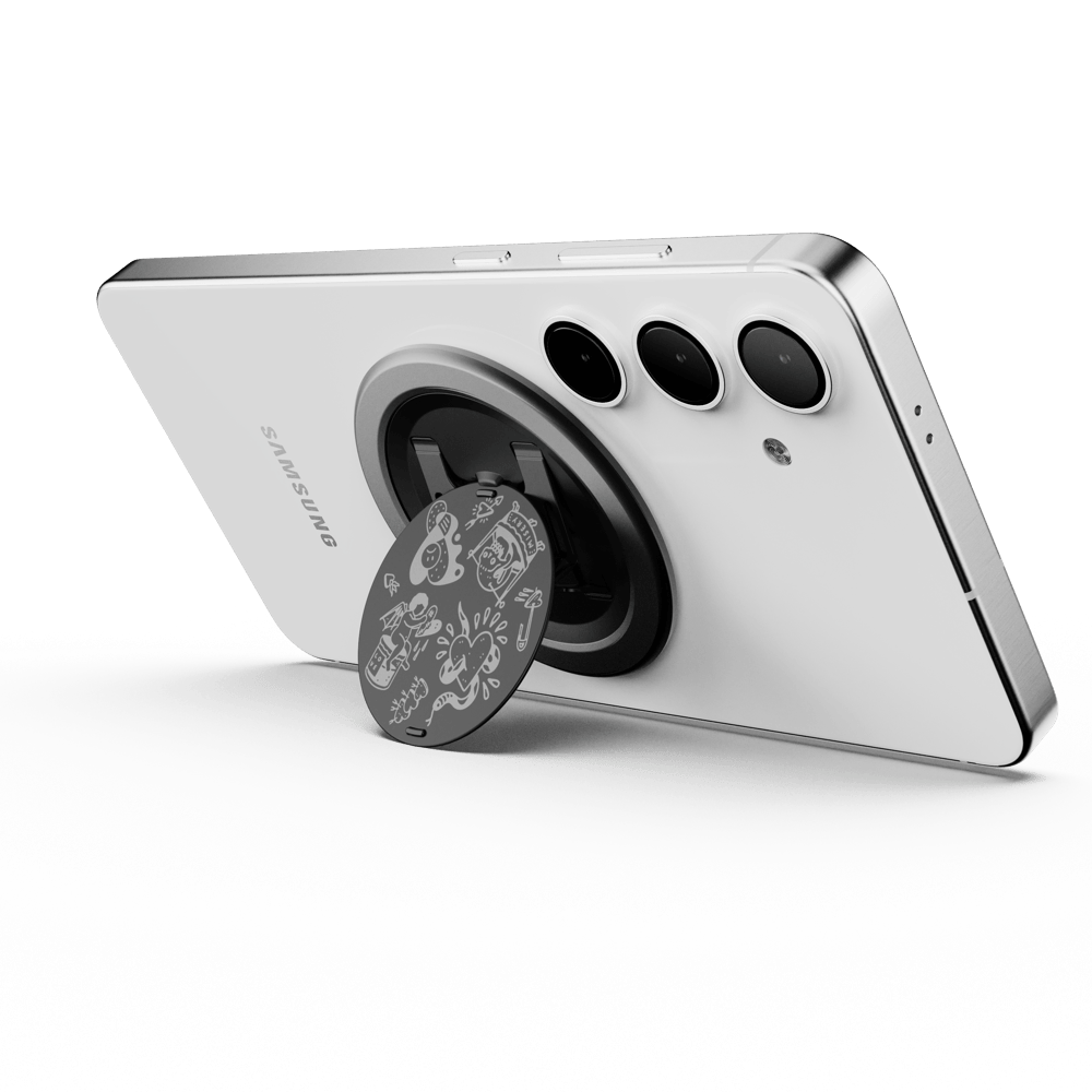 A smartphone with a circular grip attached to its back, featuring a decorative design.