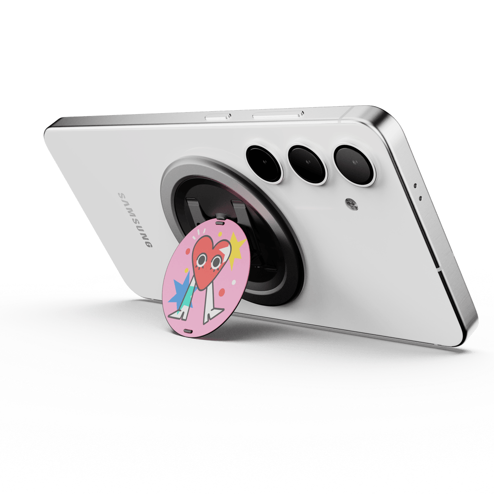 A smartphone with a circular grip attached, featuring a colorful design, positioned on a white background.