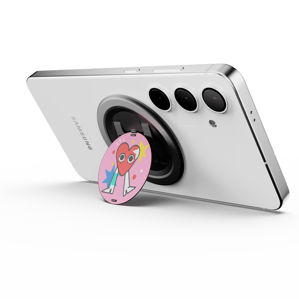 A smartphone with a circular grip attached, featuring a colorful design, positioned on a white background.