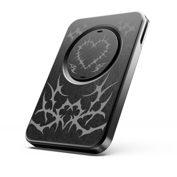 Black wallet with intricate silver design and a circular magnetic charging area on the front.