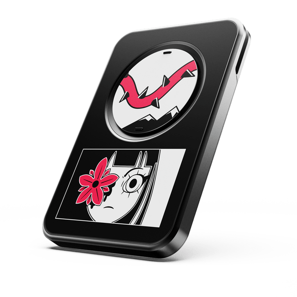 Black wallet featuring graphic designs, including a flower and a stylized face, with a circular element on top.