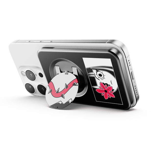 Wallet attachment on a smartphone featuring a circular grip with a design and two decorative stickers on the case.