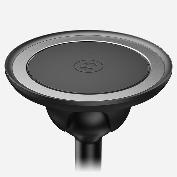 Black circular stand with a silver rim and a central logo, designed for holding devices securely.