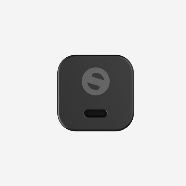 Compact black wall adapter with a USB-C port and a logo on the front.